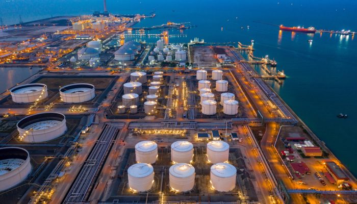 Aerial view oil and gas terminal storage tank farm,Tank farm storage chemical petroleum petrochemical refinery product, Business commercial trade fuel and energy transport by tanker vessel.